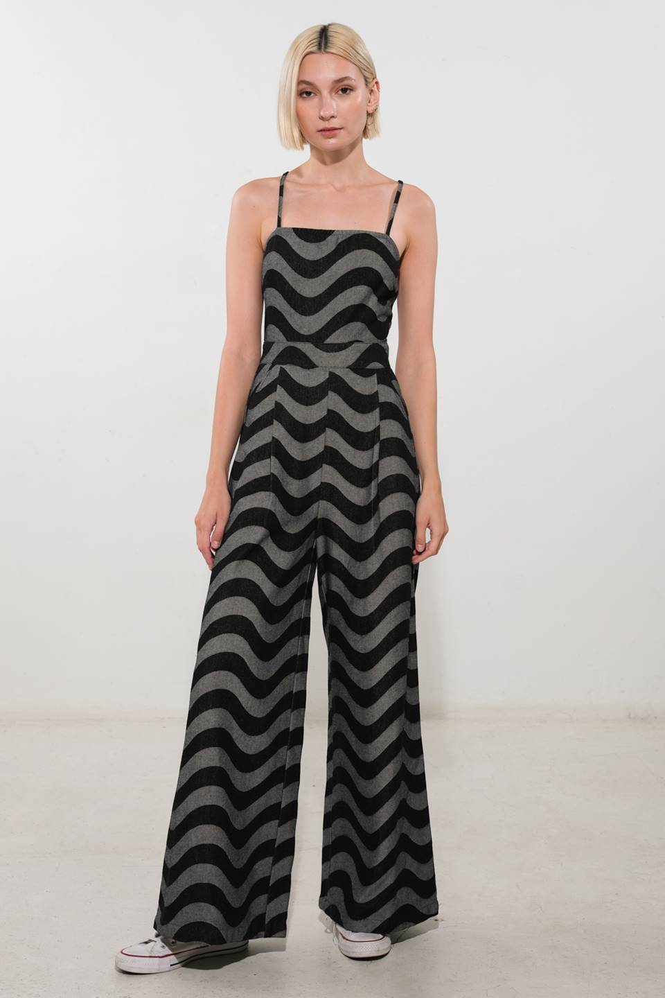  A textured denim jumpsuit featuring straight neckline, front pleat, side pocket, bare back with straps and zipper closure  Details:  Self : 90% Cotton 10% Polyester  Size &amp; Fit  - Model is 5`9" And Wearing Size Small - Measurements Taken From Size Small - Approx. Length: 60" 