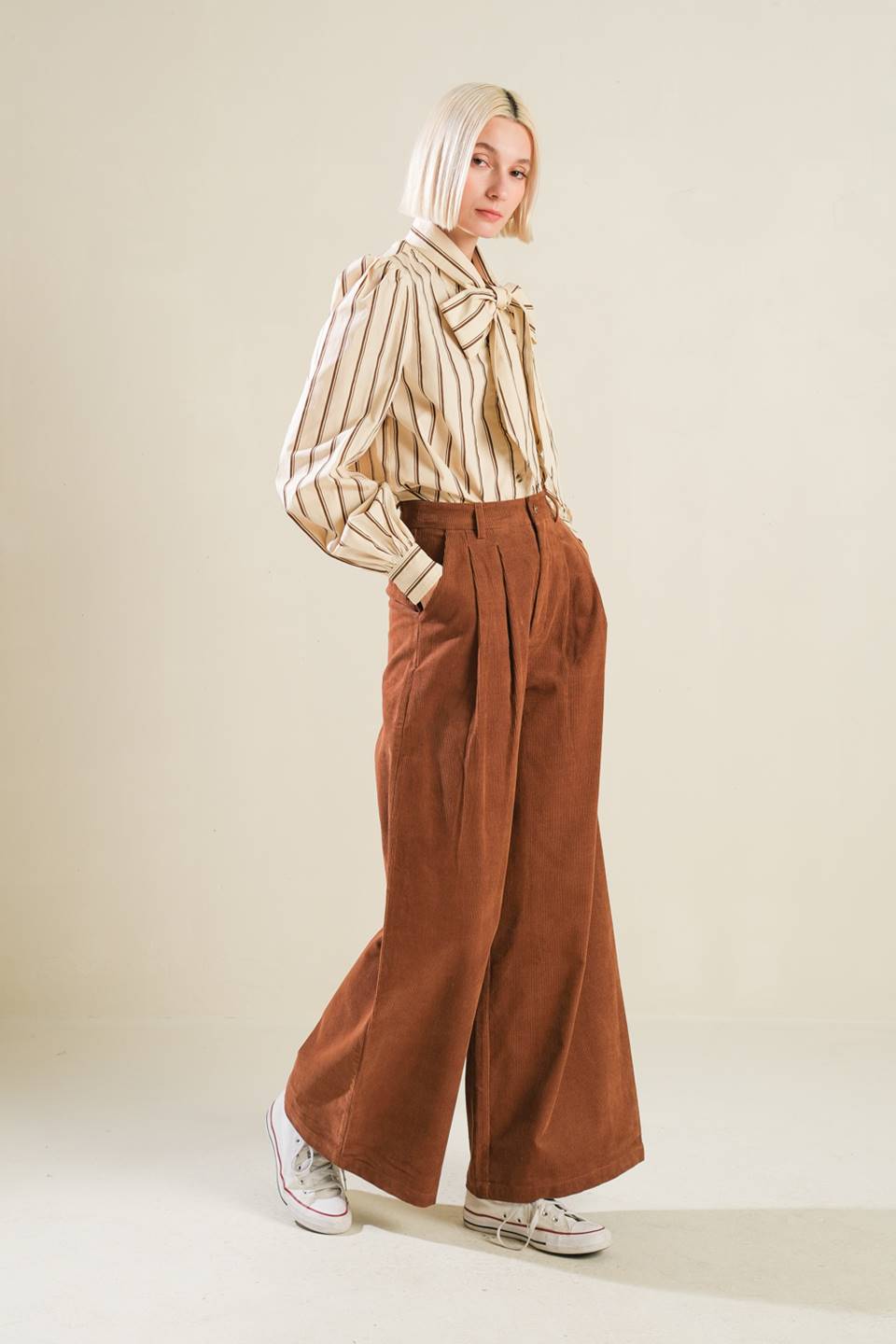 A solid woven pant featuring front closure, self sash tie, front pleat and wide leg  Details:  Self : 75% Cotton 25% Polyester  Size &amp; Fit  - Model is 5`9" And Wearing Size Small - Measurements Taken From Size Small - Approx. Length: 43"