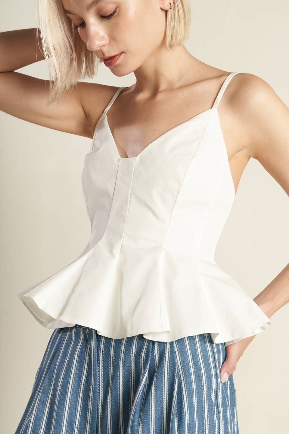  A solid woven cami top featuring straps, peplum and back zipper closure. Matching pants FP1095.  Details:  Self : 100% Polyester  Size &amp; Fit  - Model is 5`8" And Wearing Size Small - Measurements Taken From Size Small - Approx. Length: 22" 